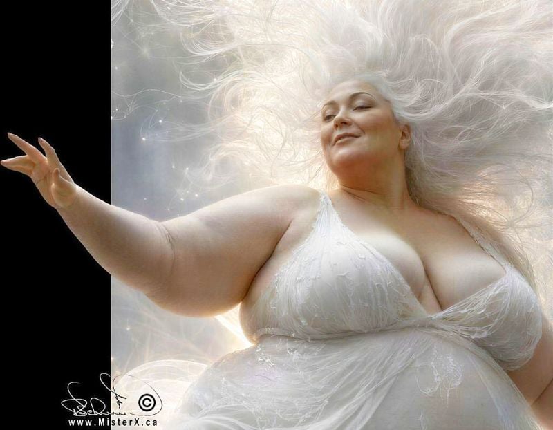 A large-bodied woman with light skin and a smiling expression is depicted from the waist up. She lies against a bright backdrop, surrounded by white, flowing strands that resemble hair or fiber optics, intertwined with small, glowing star-like lights. Her head is tilted slightly back and to the right, looking upwards with a soft smile on her face. Her white hair, light gray at the roots, flows out around her head, blending into the ethereal background, creating a halo effect. She is wearing a white garment that looks like a sheer, flowing dress or fabric that gathers around her chest and body, hinting at a deep neckline. Her left arm is extended towards the viewer with her palm open and fingers slightly spread, as if presenting or reaching out. The lighting is bright and soft, with a subtle glow around her.